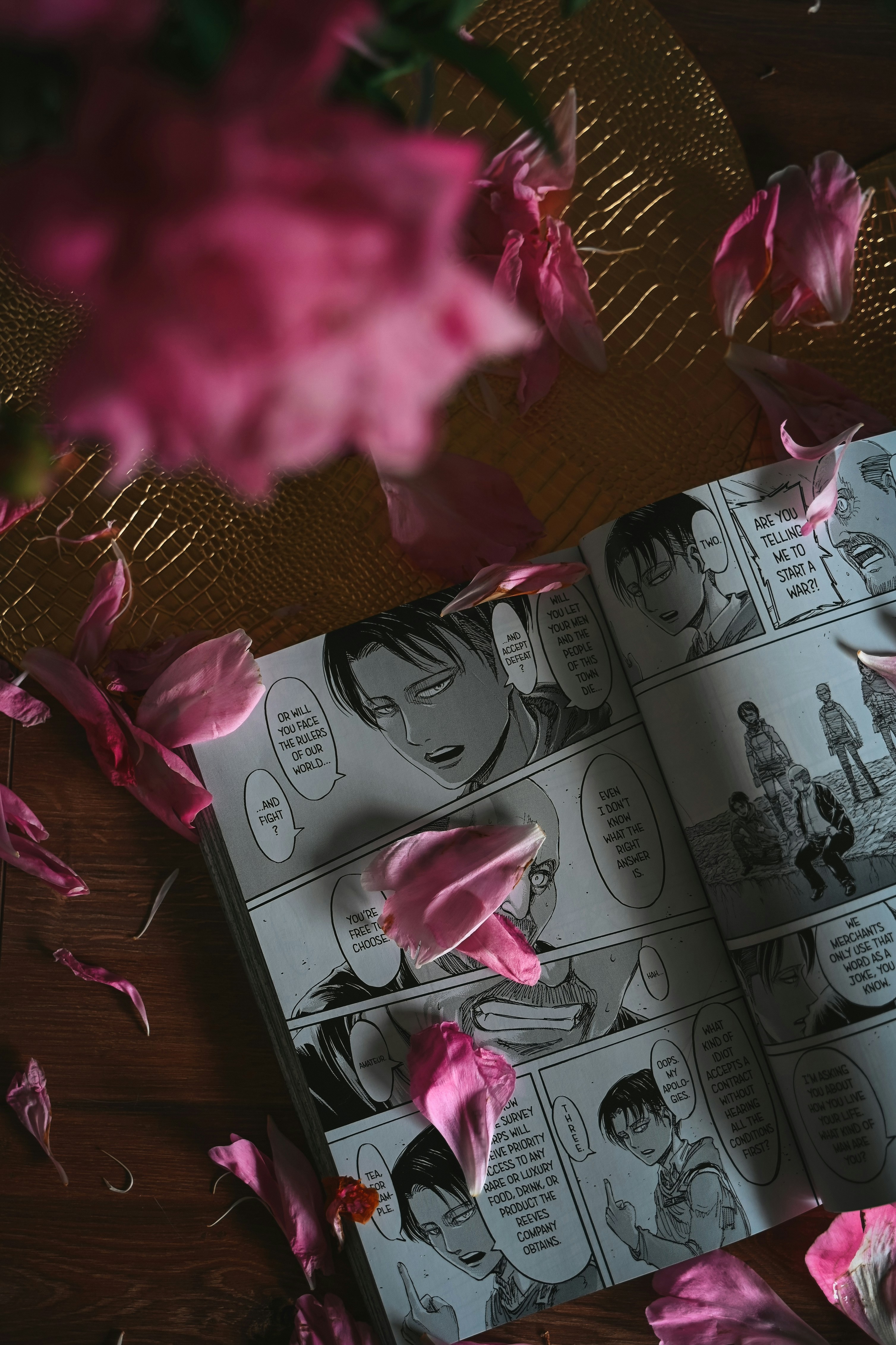 Manga pages with pink flower petals scattered around