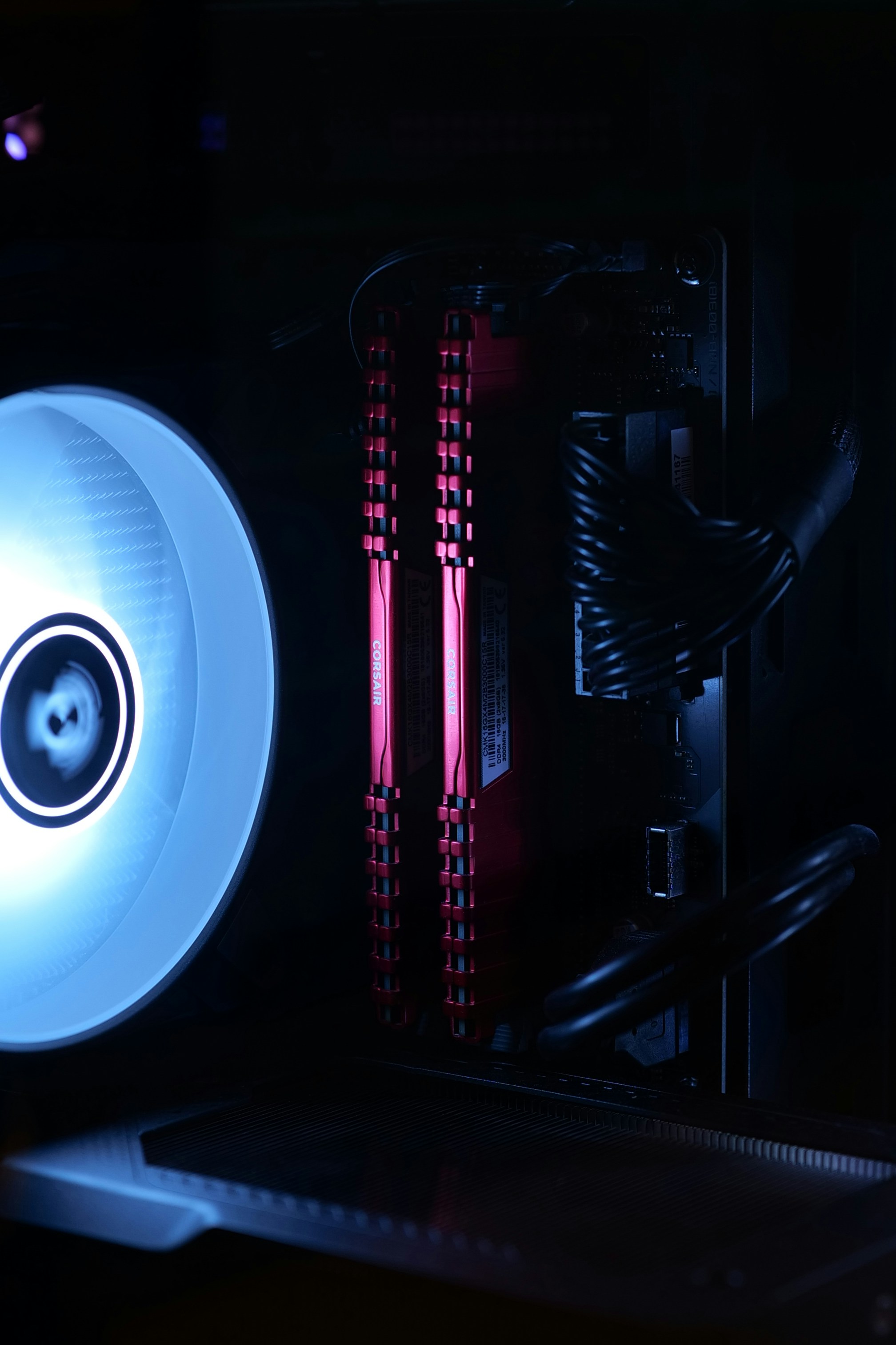 Computer ram modules with glowing red lights.