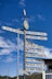 Directional signpost pointing to cities around the world