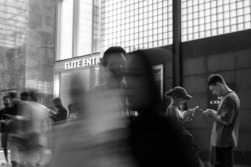 People walking in a blurred urban environment