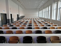 Empty lecture hall with rows of seats