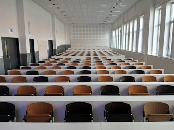 Empty lecture hall with rows of seats