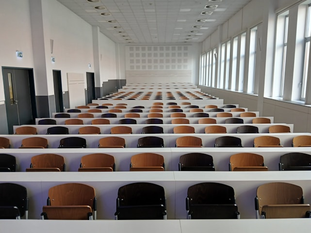 Empty lecture hall with rows of seats