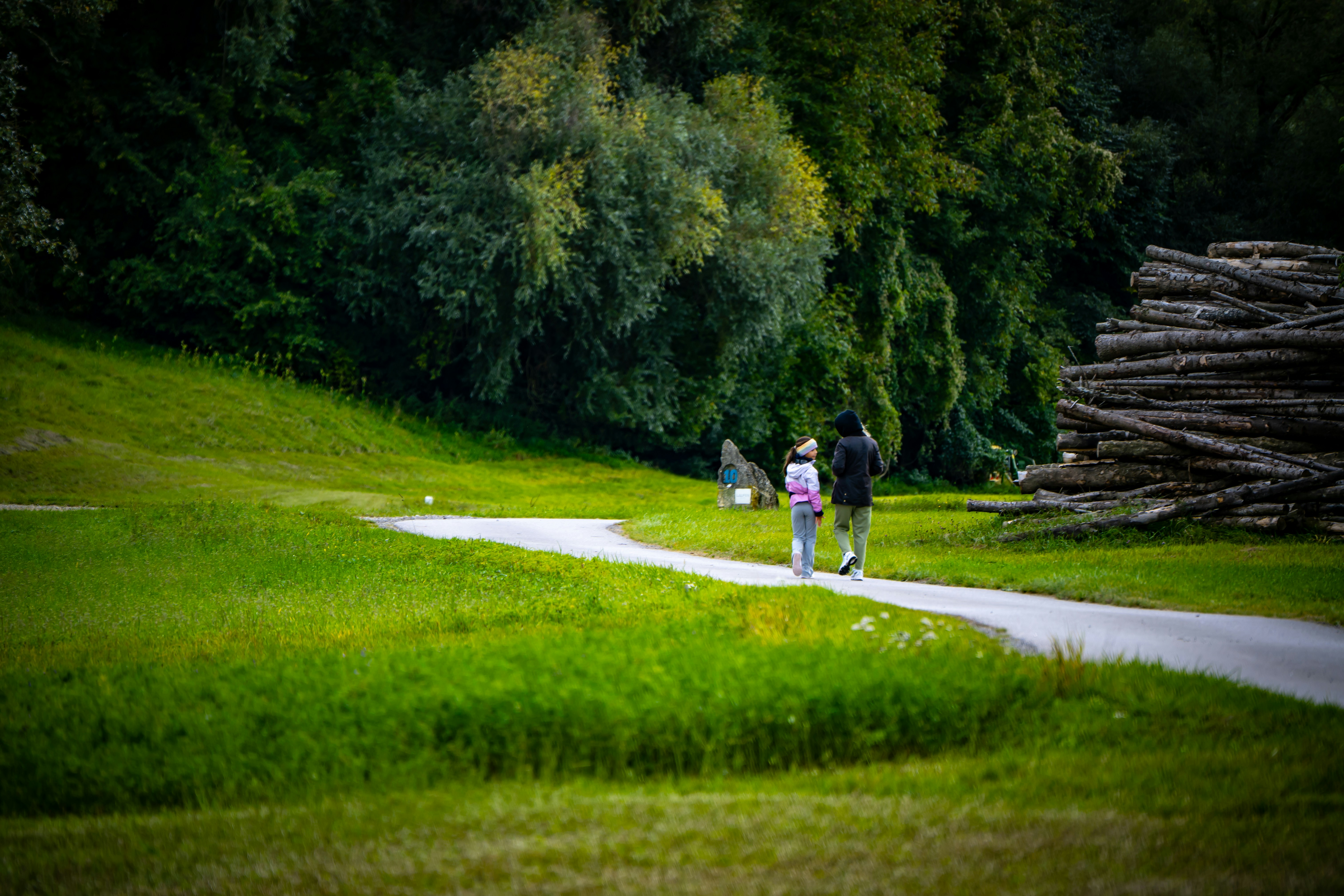 Adult walking briskly on an outdoor path for moderate-intensity exercise