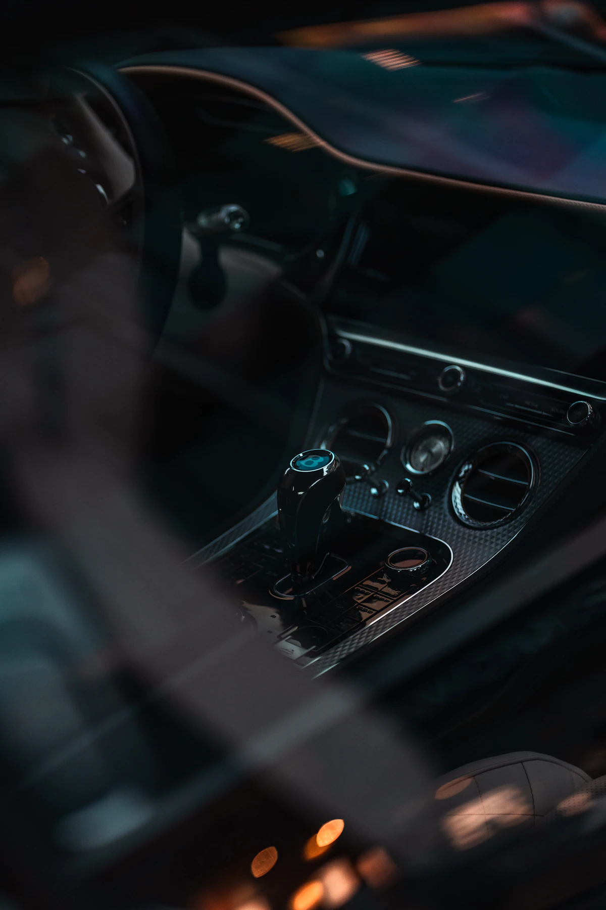 Premium car interior with gear selector, dashboard, and center console