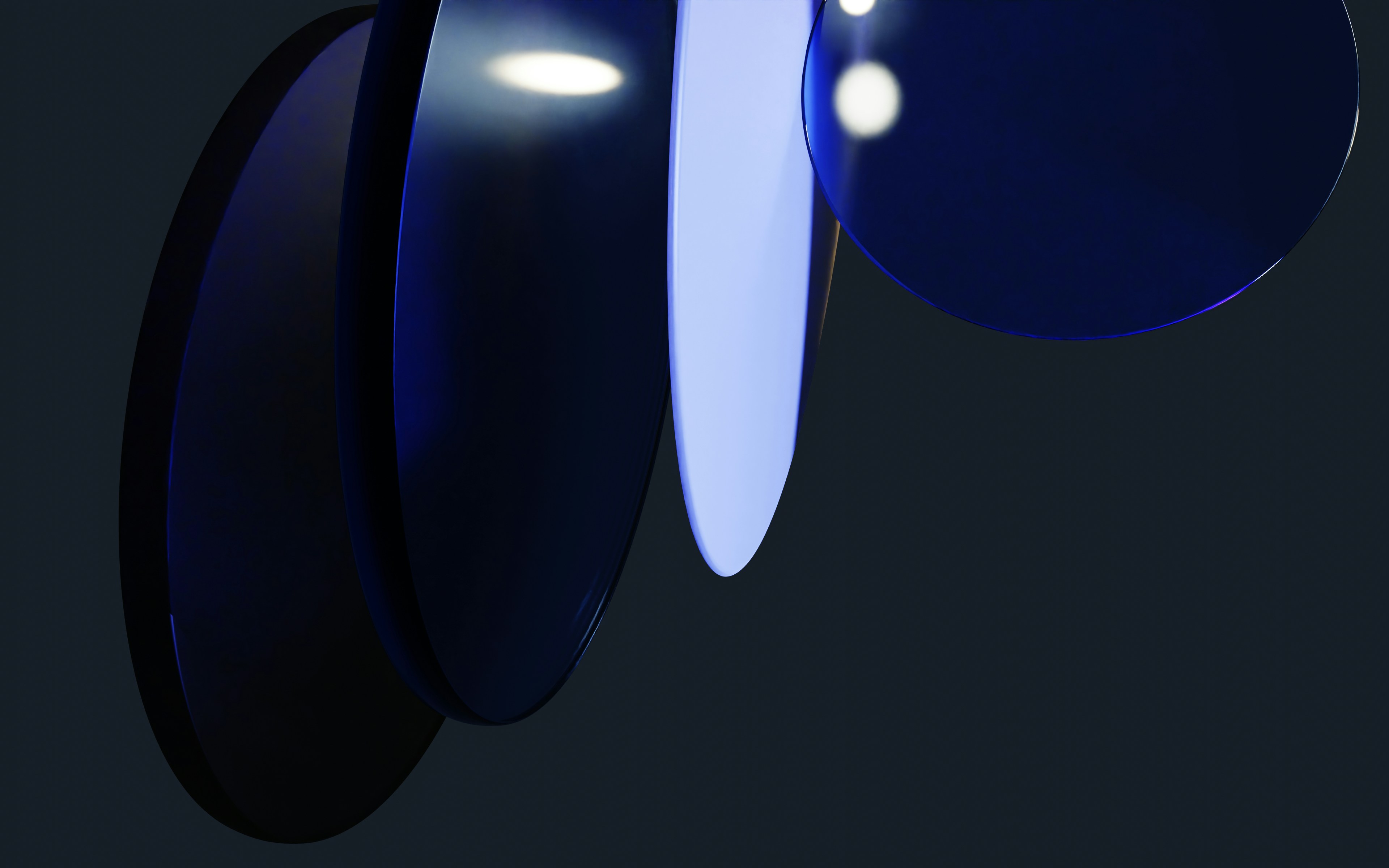 Abstract blue discs with highlights on dark background