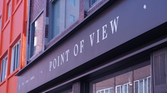 Point of view sign on a building facade.