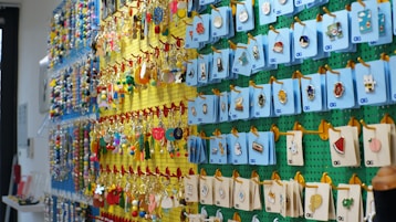 Wall display of colorful keychains and trinkets
