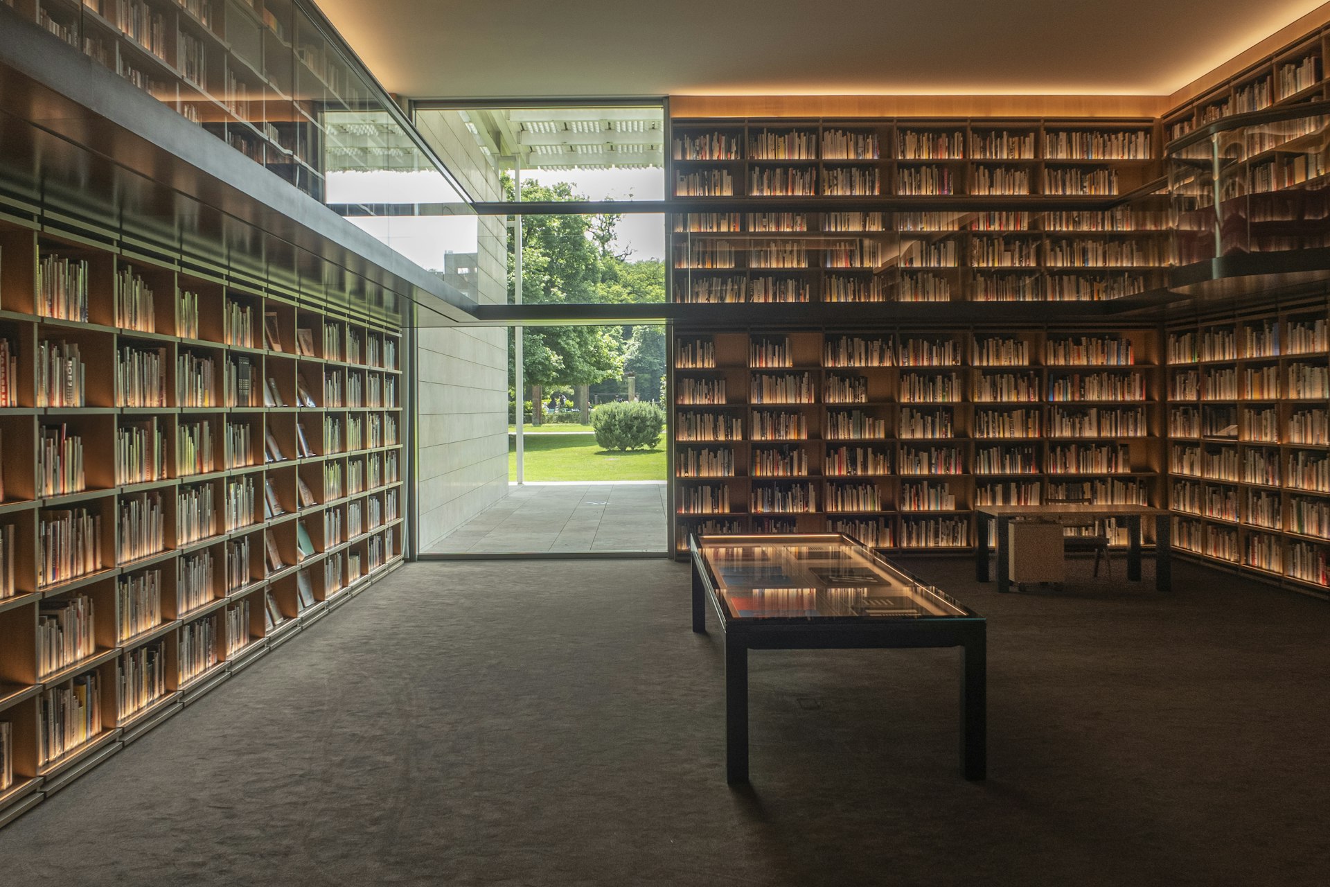 A quiet library with floor-to-ceiling wooden shelving