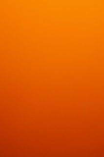 A smooth gradient of orange to dark orange.