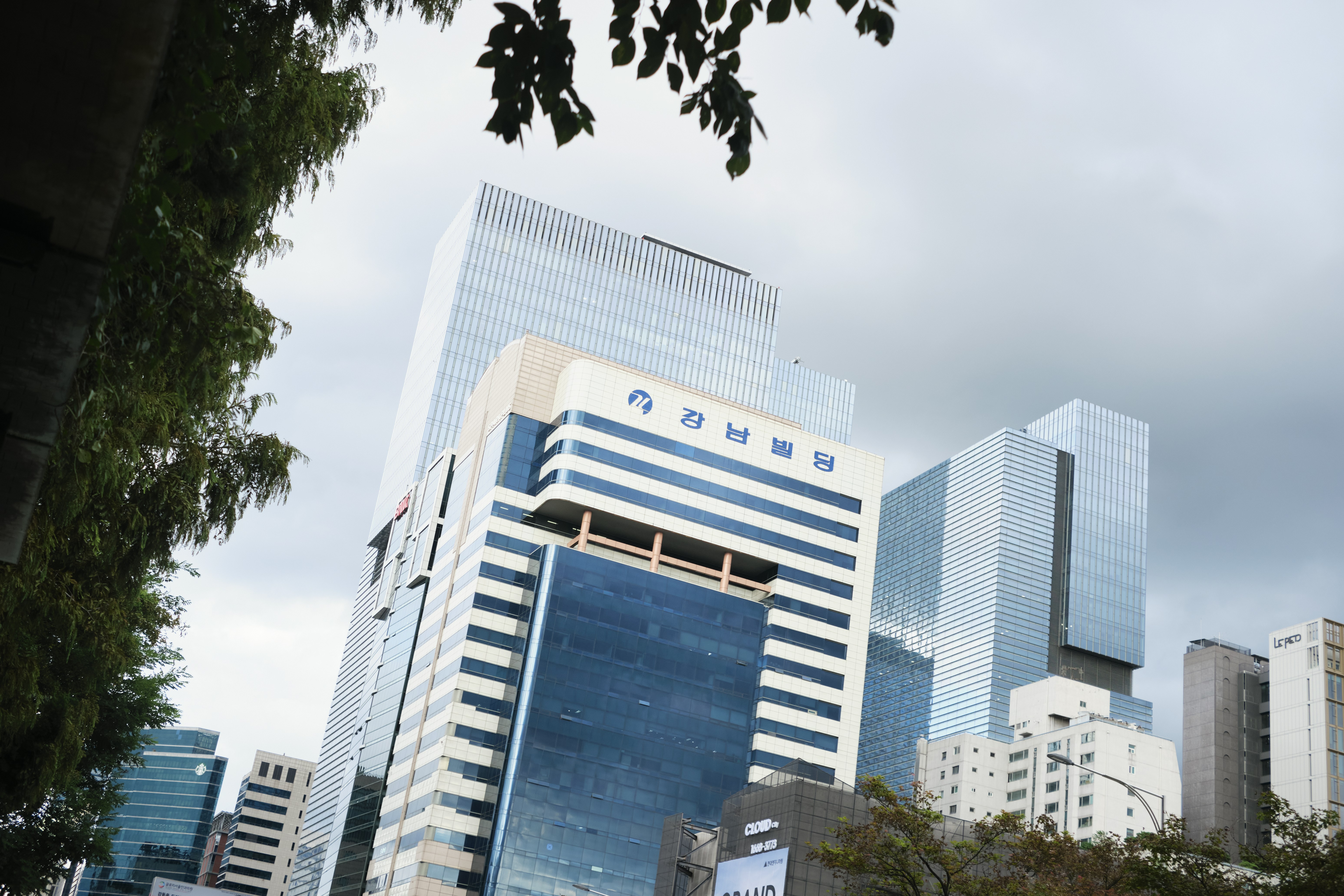 Modern skyscrapers against a cloudy sky