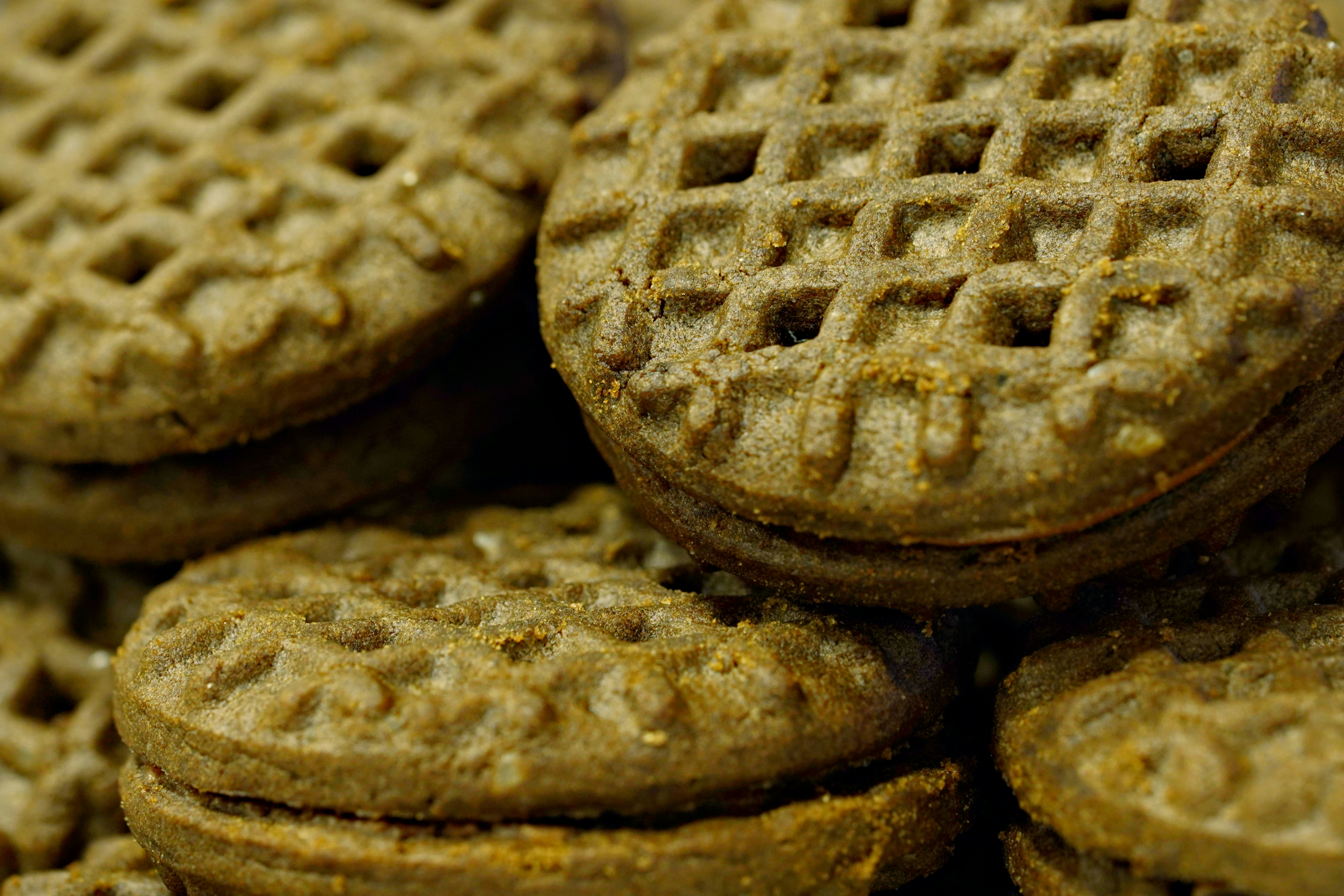 Close-up of stacked round cookies with waffle pattern