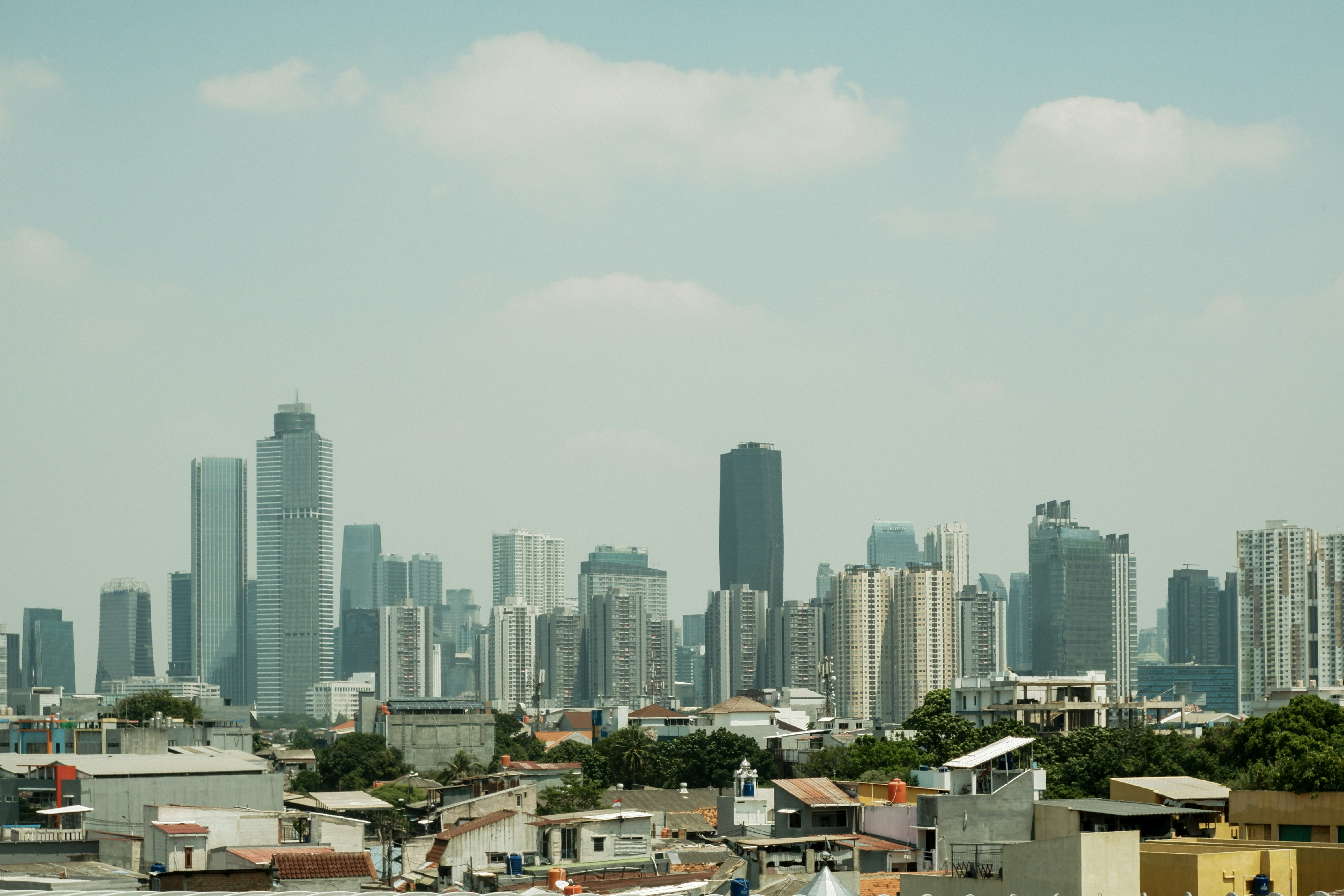 Modern cityscape with tall buildings under a clear sky