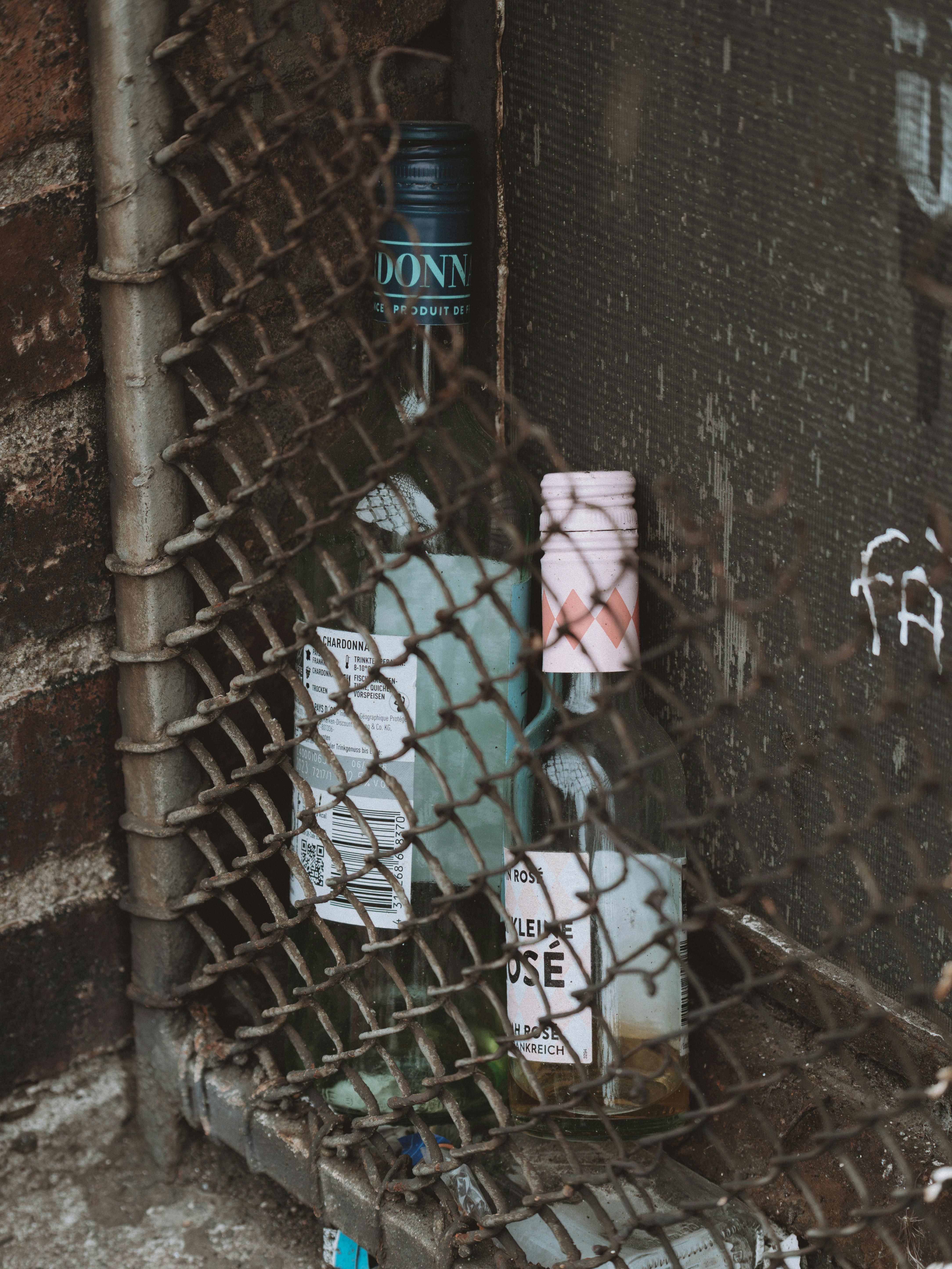 Bottles caught in a chain-link fence