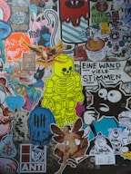 A collage of colorful and diverse stickers on a wall.