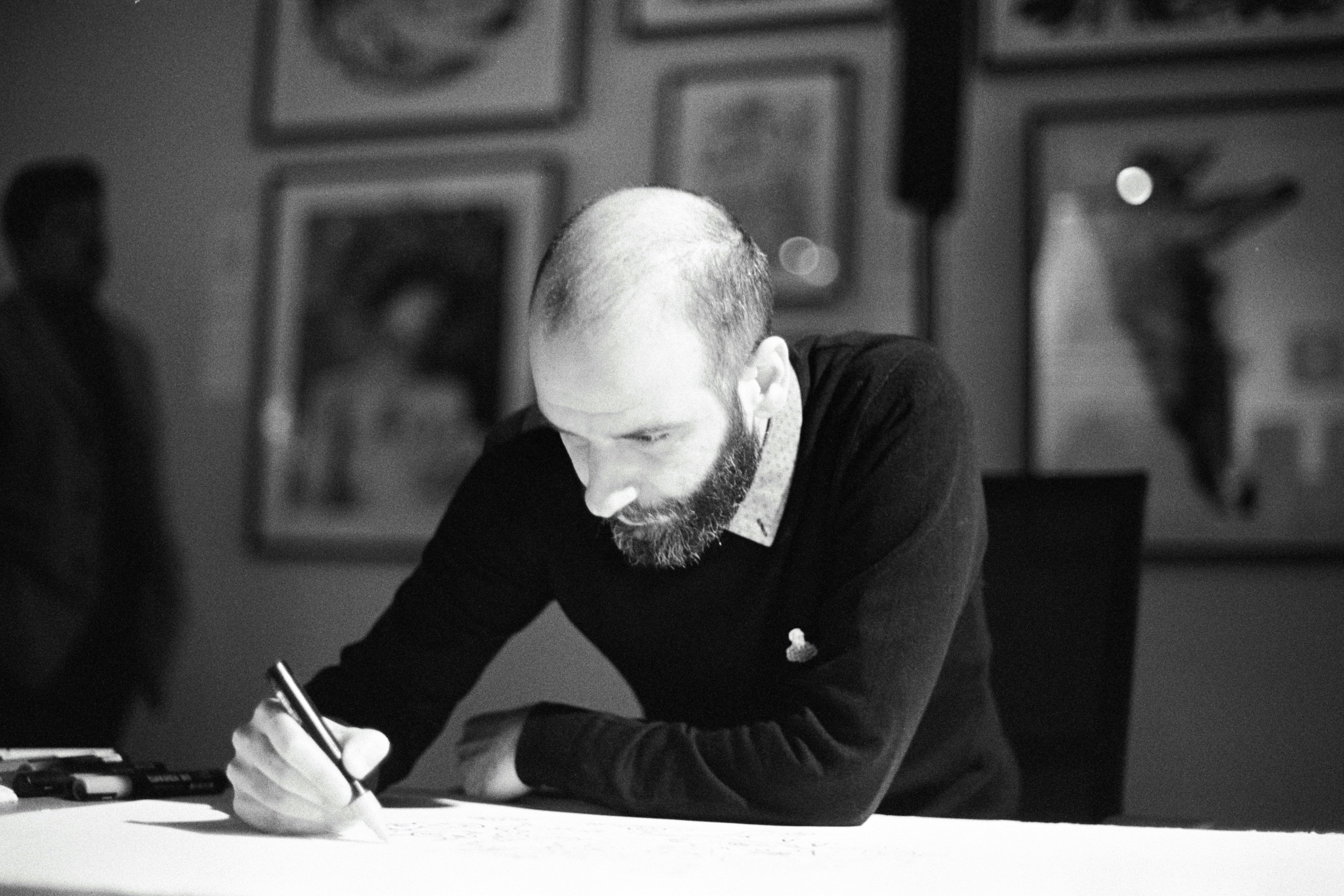 Man drawing on paper