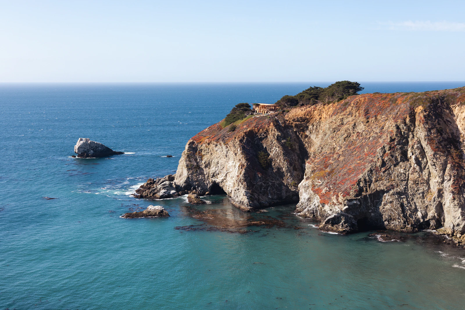 California Pacific Coast Highway rocky cliffs and blue ocean — best group day trips from Oxnard by van