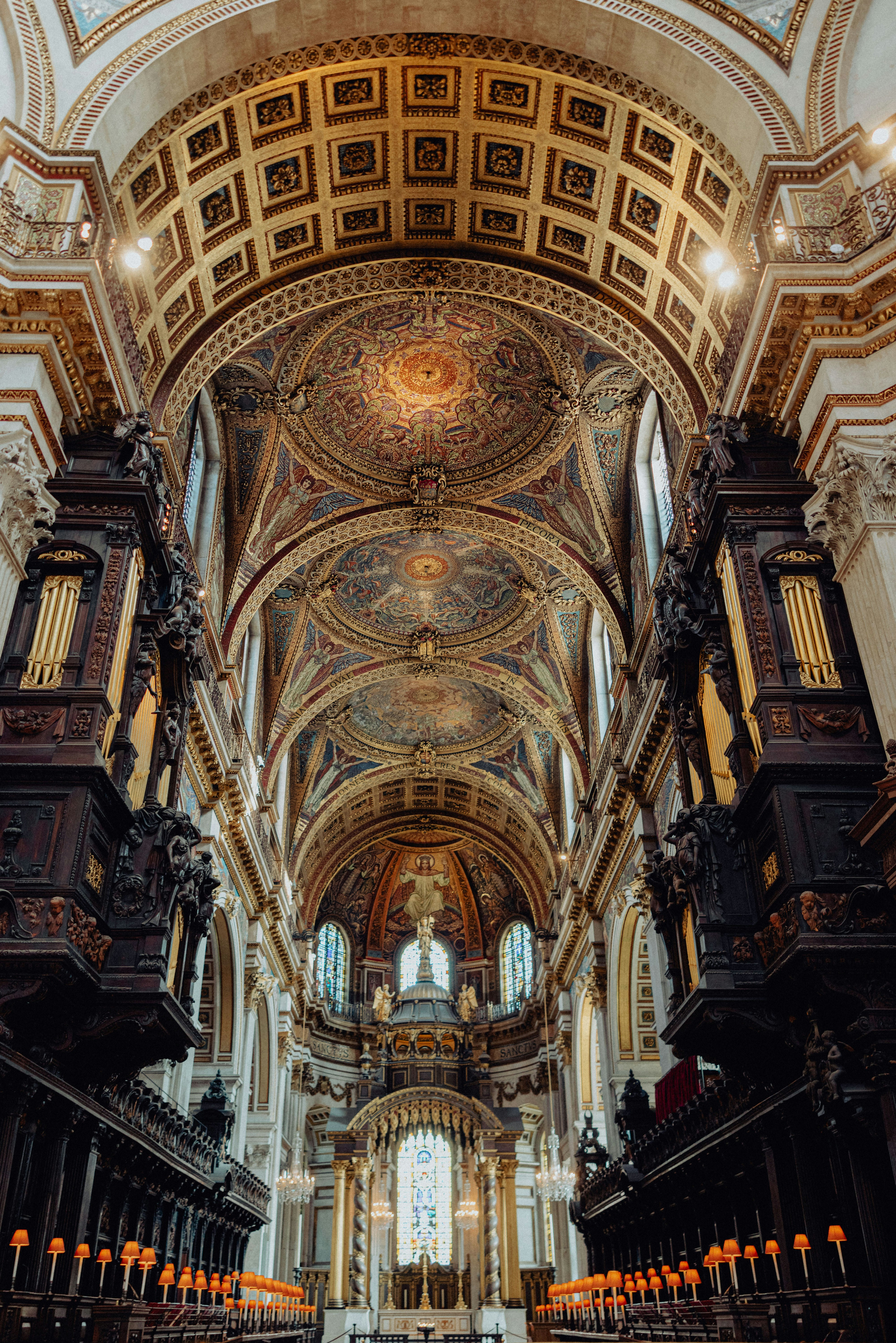 Grand interior of a cathedral with ornate ceiling.