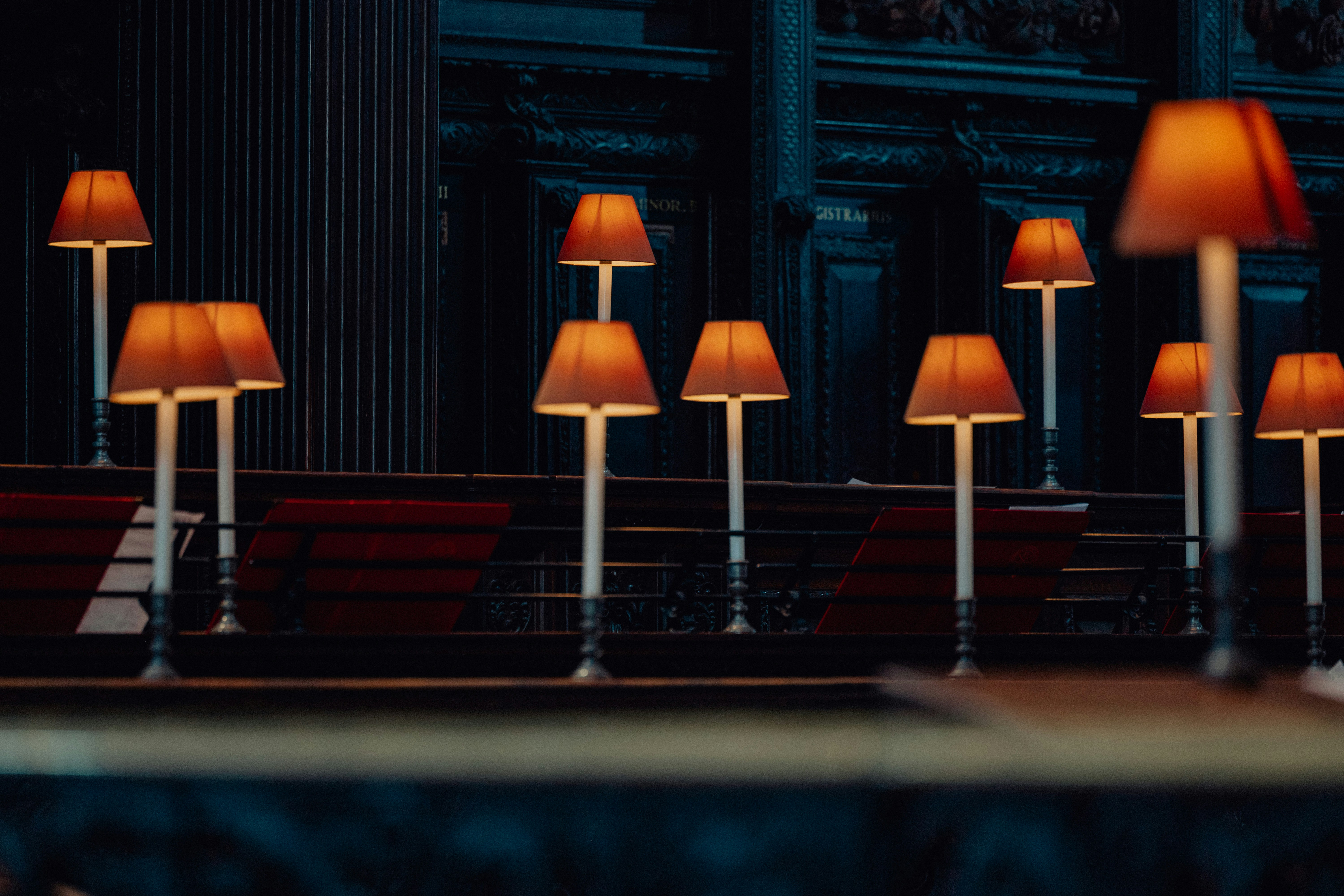 Several lamps illuminated in a dark room