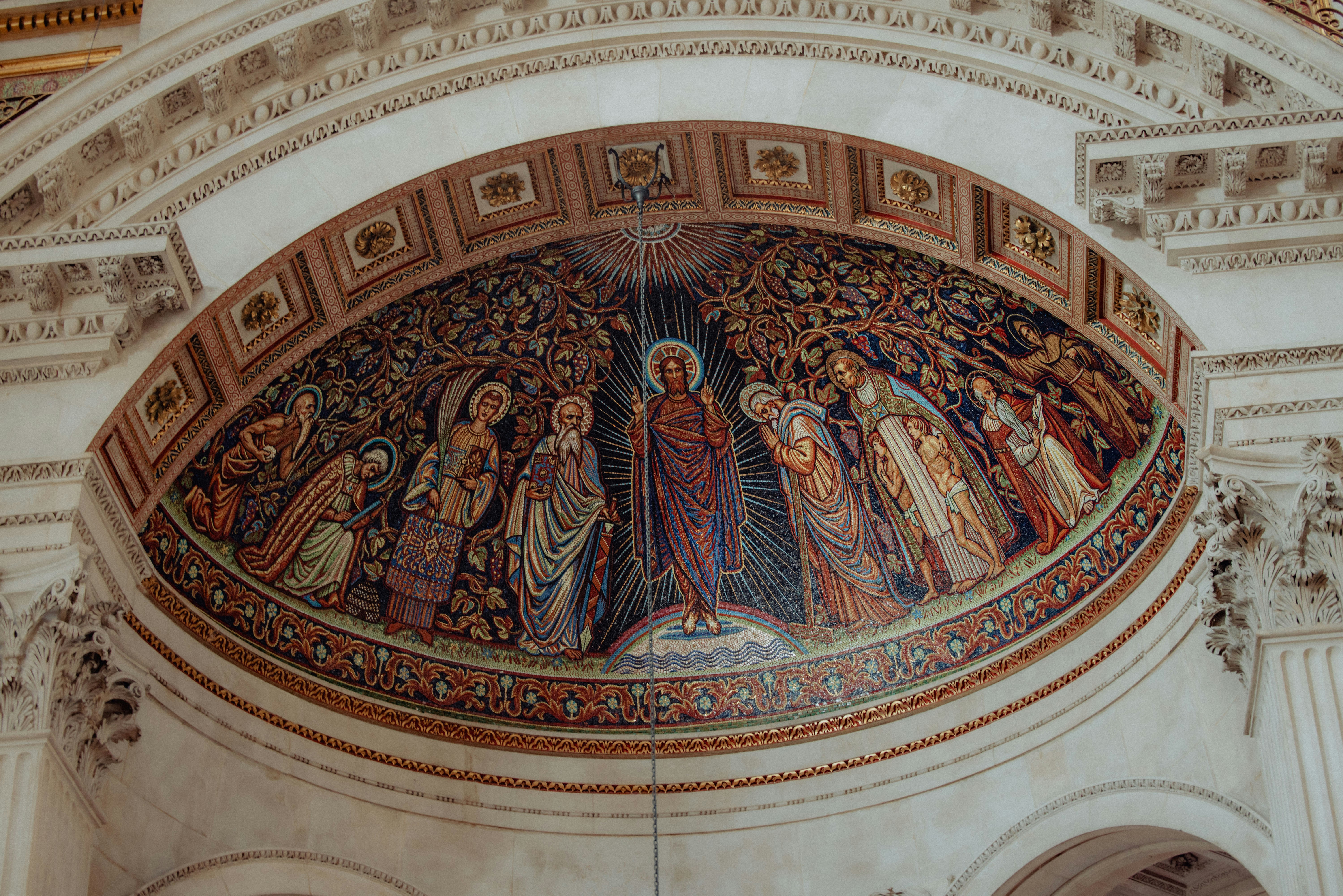 Religious mosaic depicting baptism scene with figures