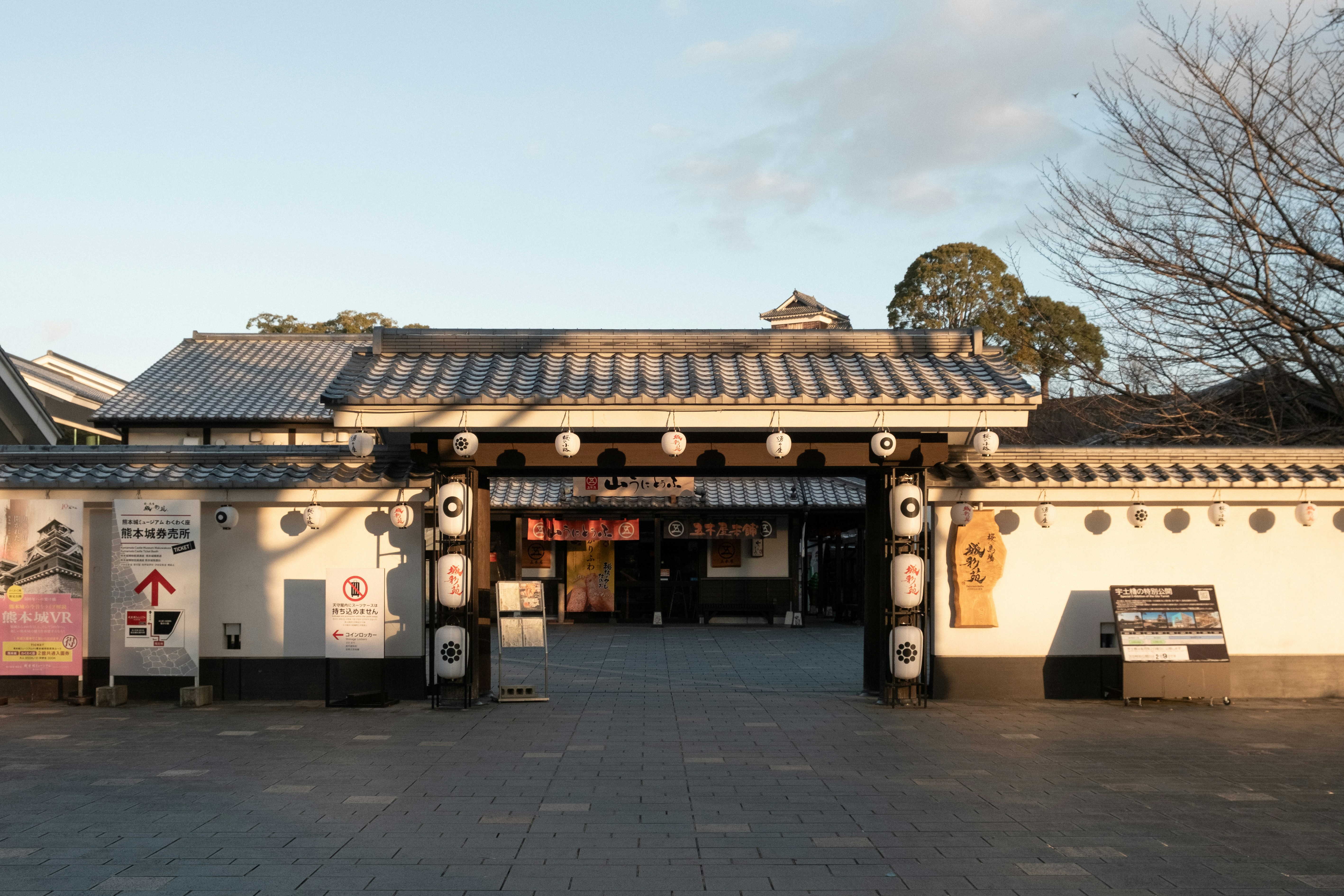 Traditional japanese gate entrance with white walls