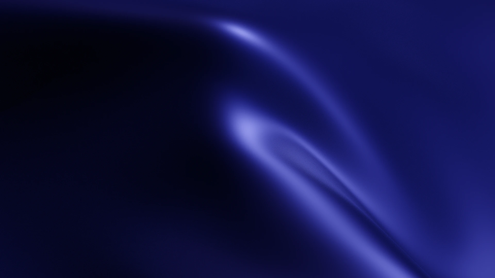 Abstract deep blue and purple swirling light patterns