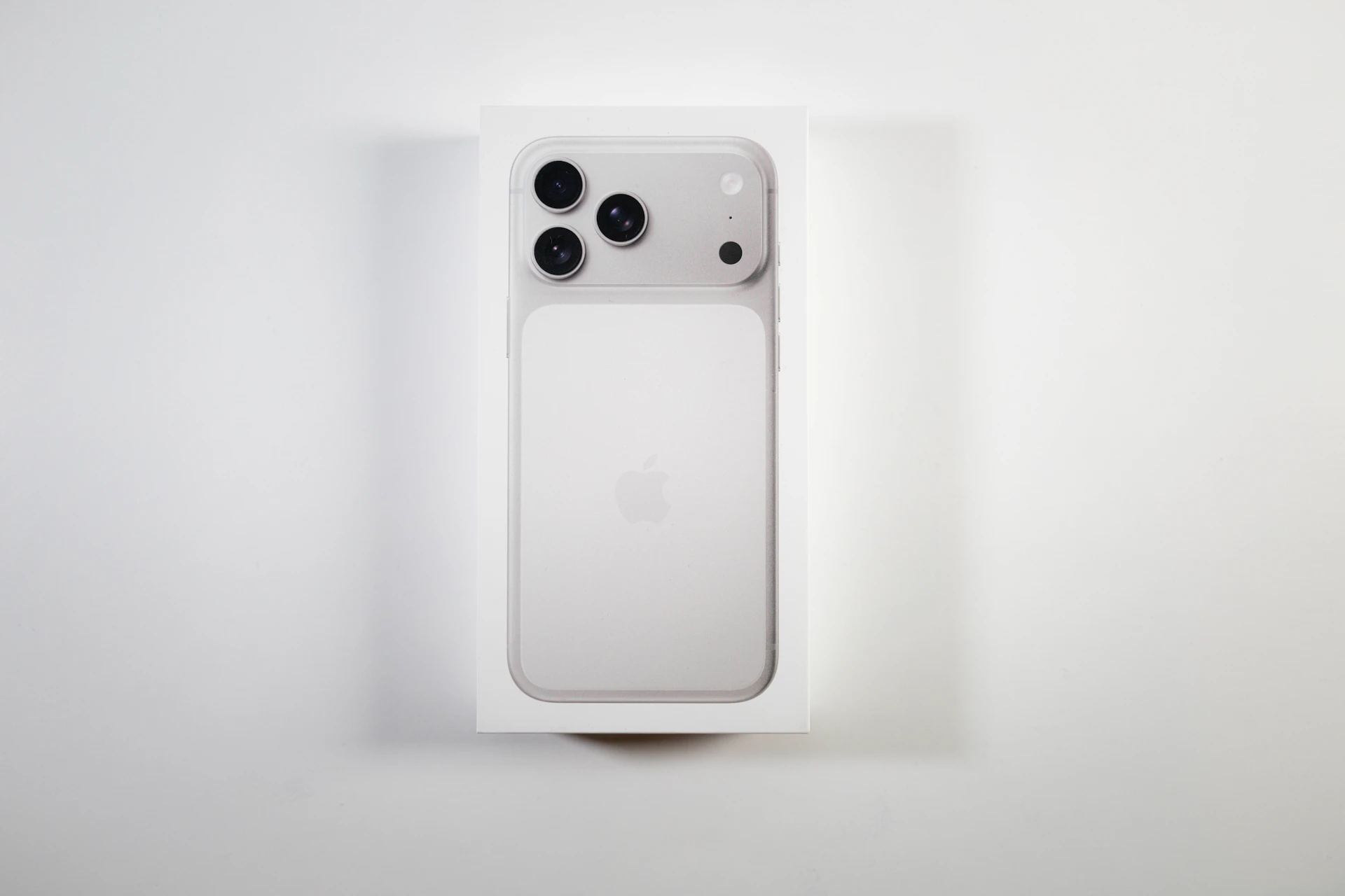 A white smartphone box with a phone inside