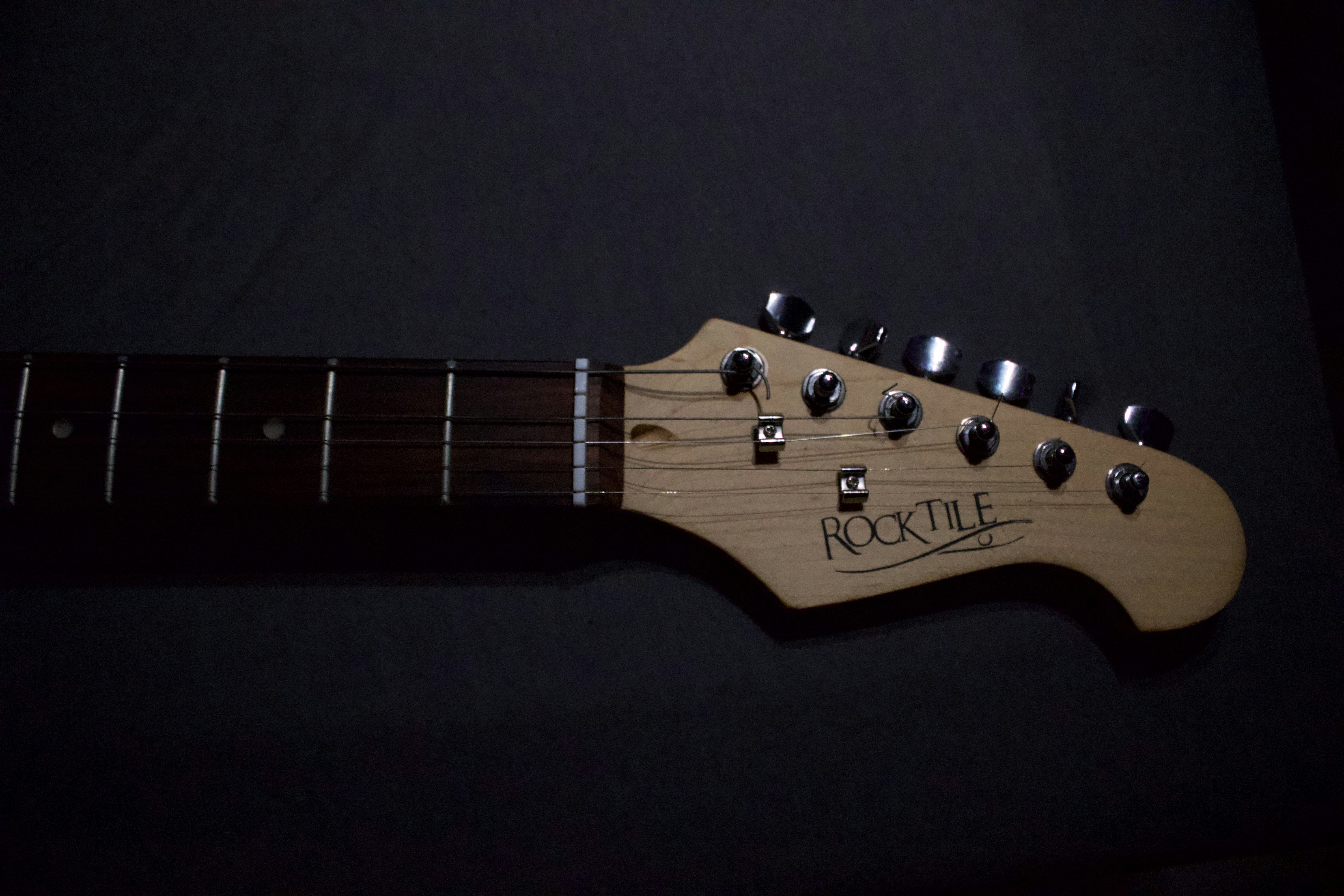 Close-up of a guitar headstock with tuning pegs