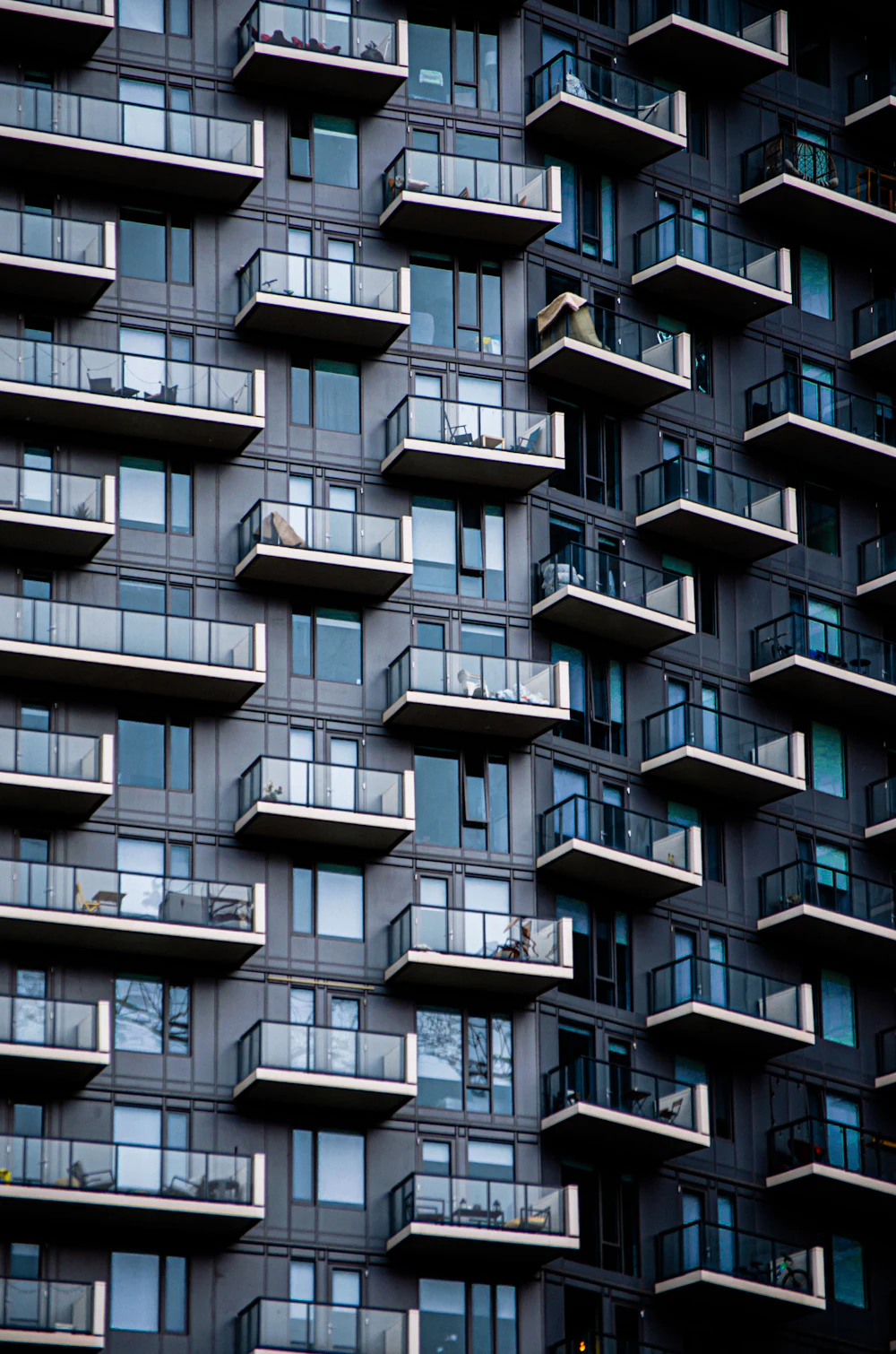 High-rise apartment balconies secured with invisible safety grills