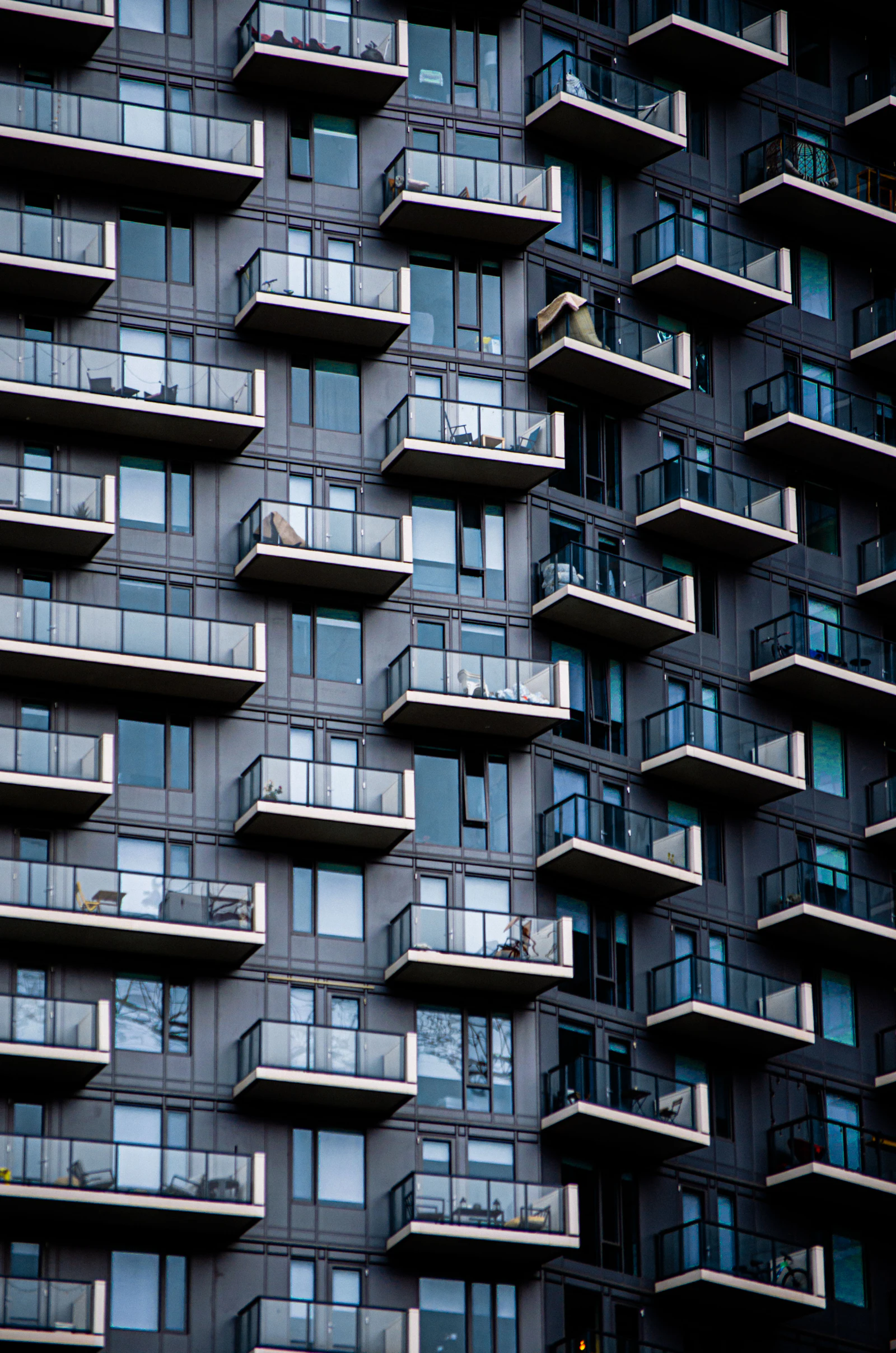 Modern apartment building facade with many balconies
