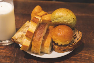 Assortment of breads and a glass of milk