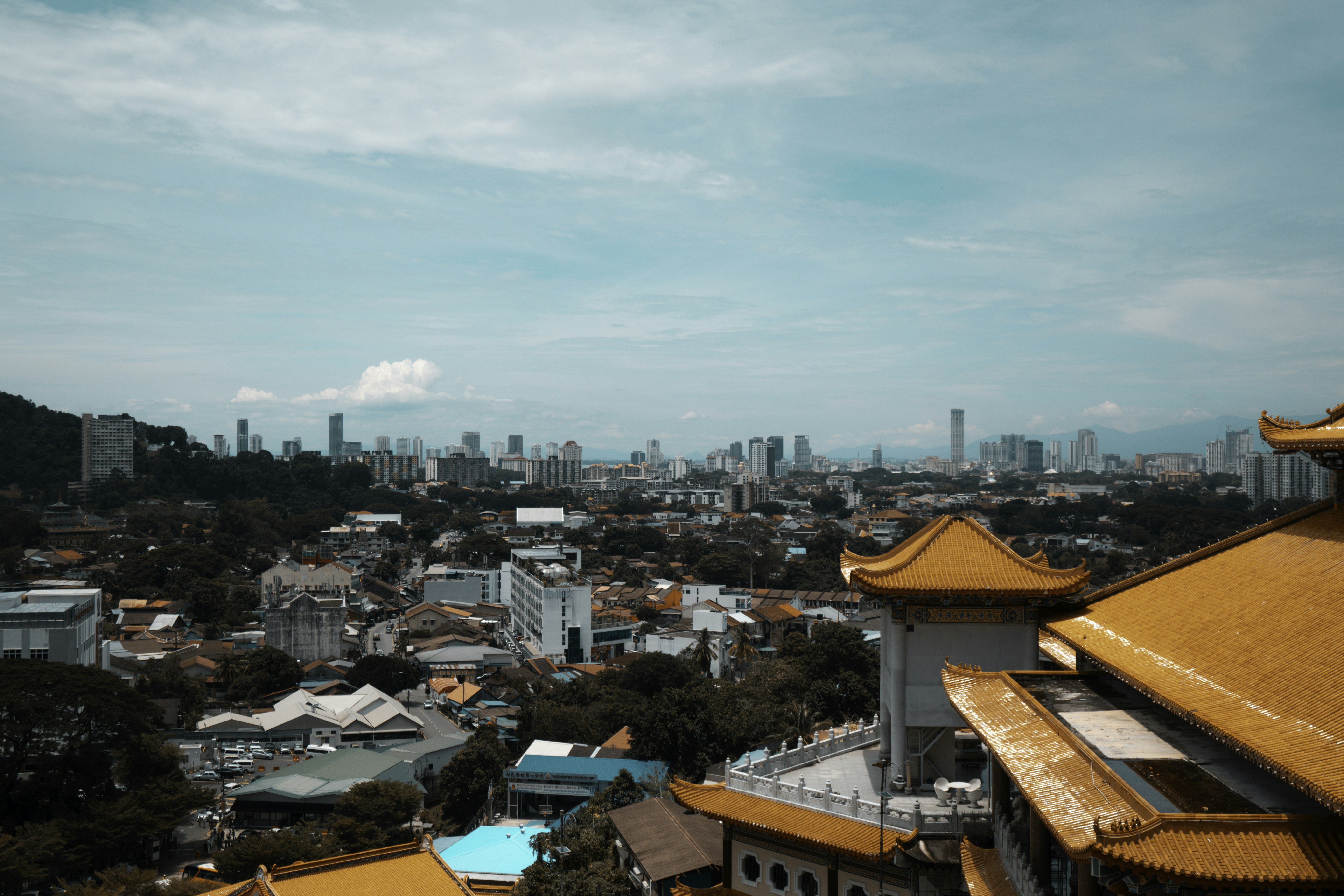City skyline seen from a temple with orange roofs.
