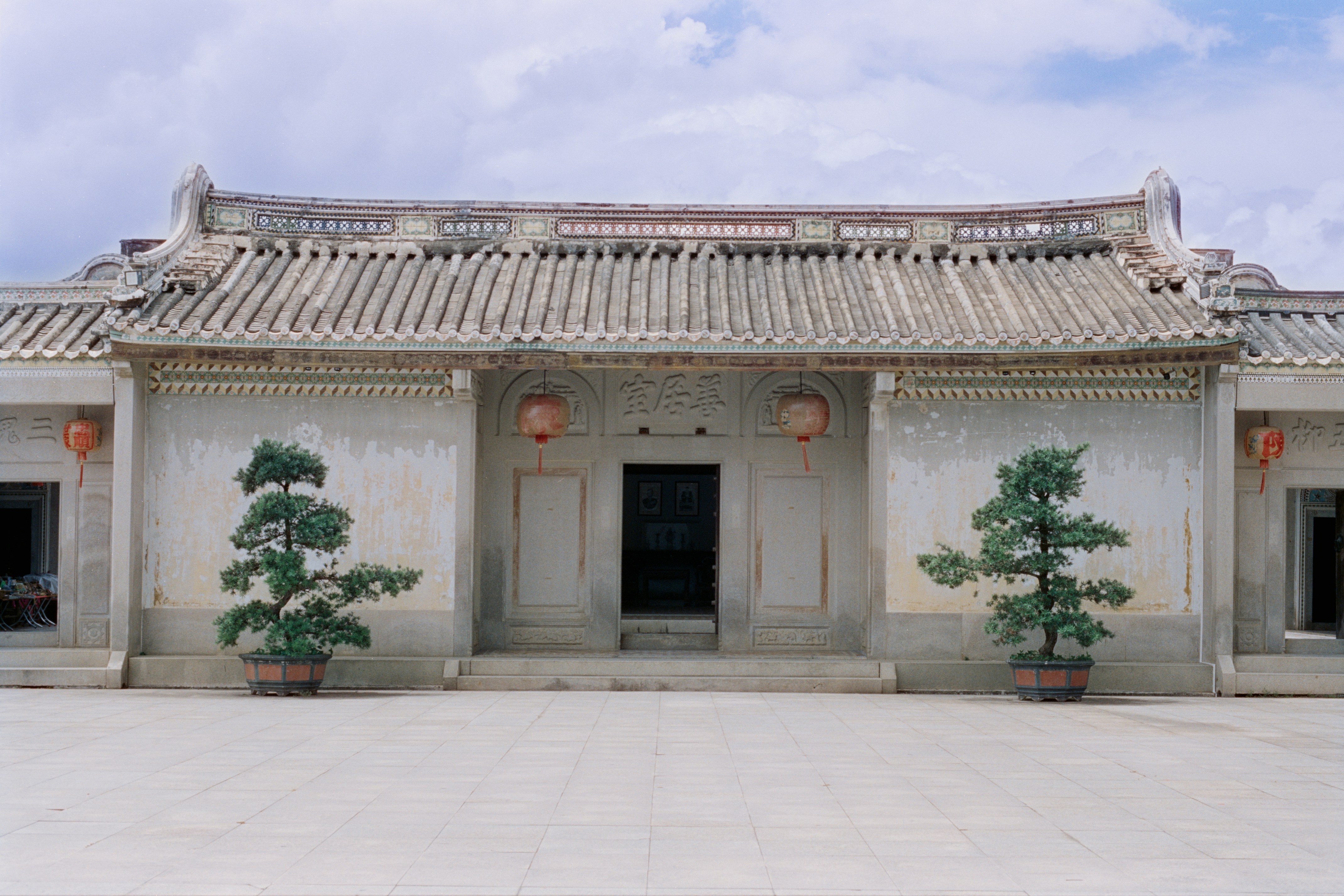 Traditional asian building with potted trees