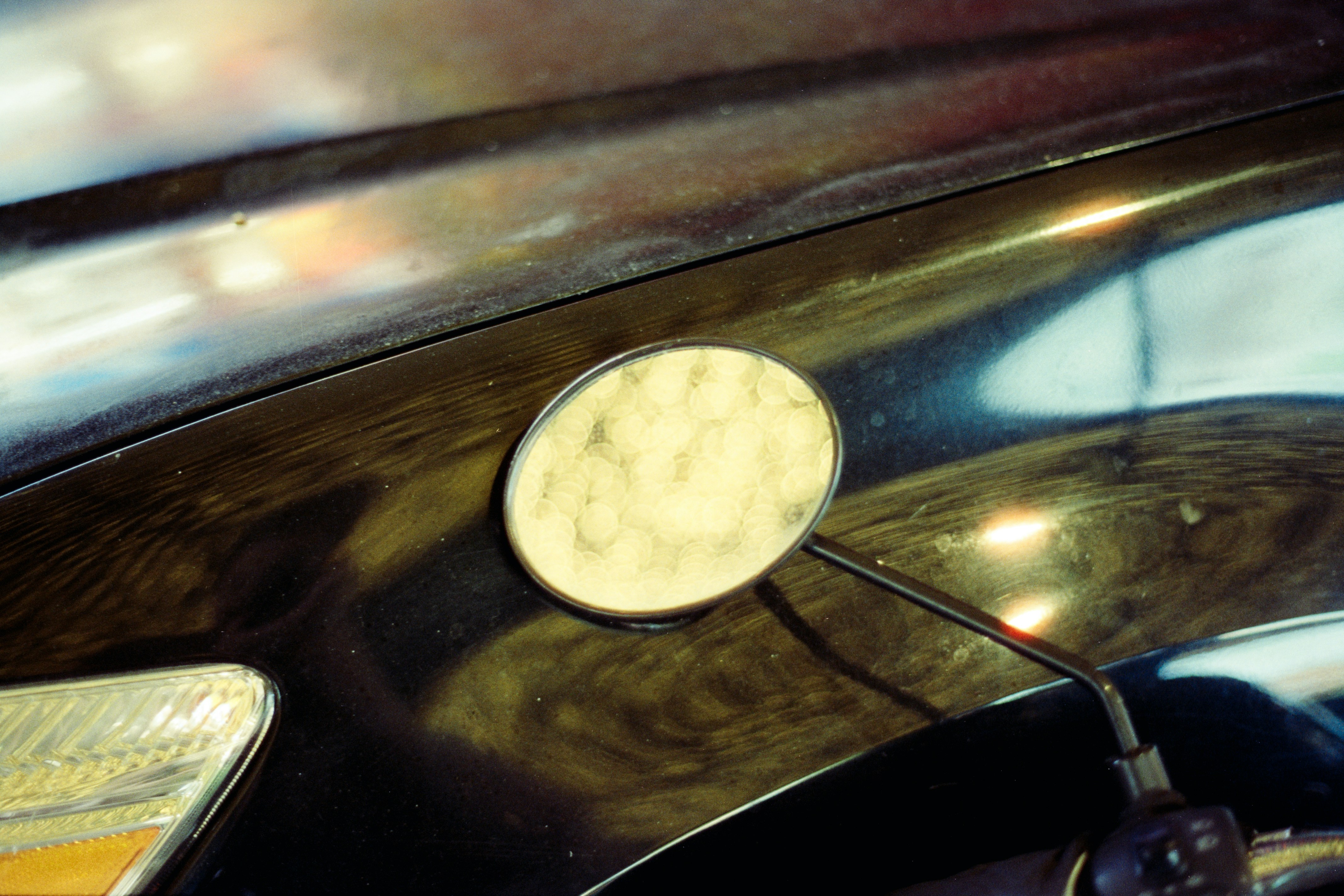Close-up of a motorcycle's side mirror