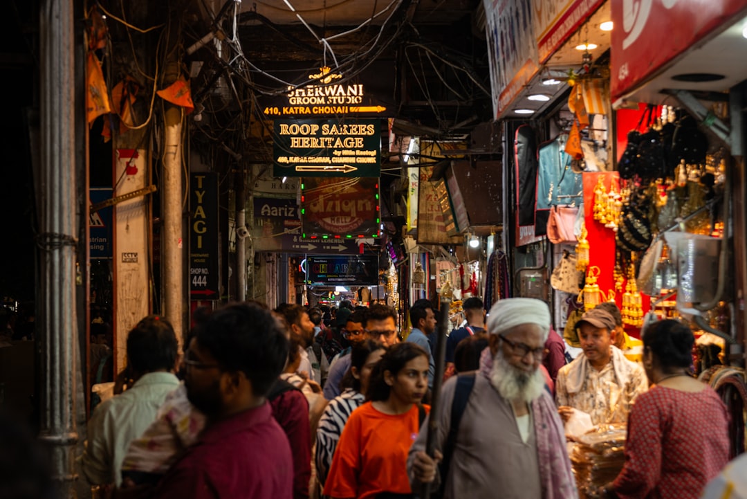 A bustling Indian jewelry store with customers examining gold ornaments, reflecting the cultural significance.