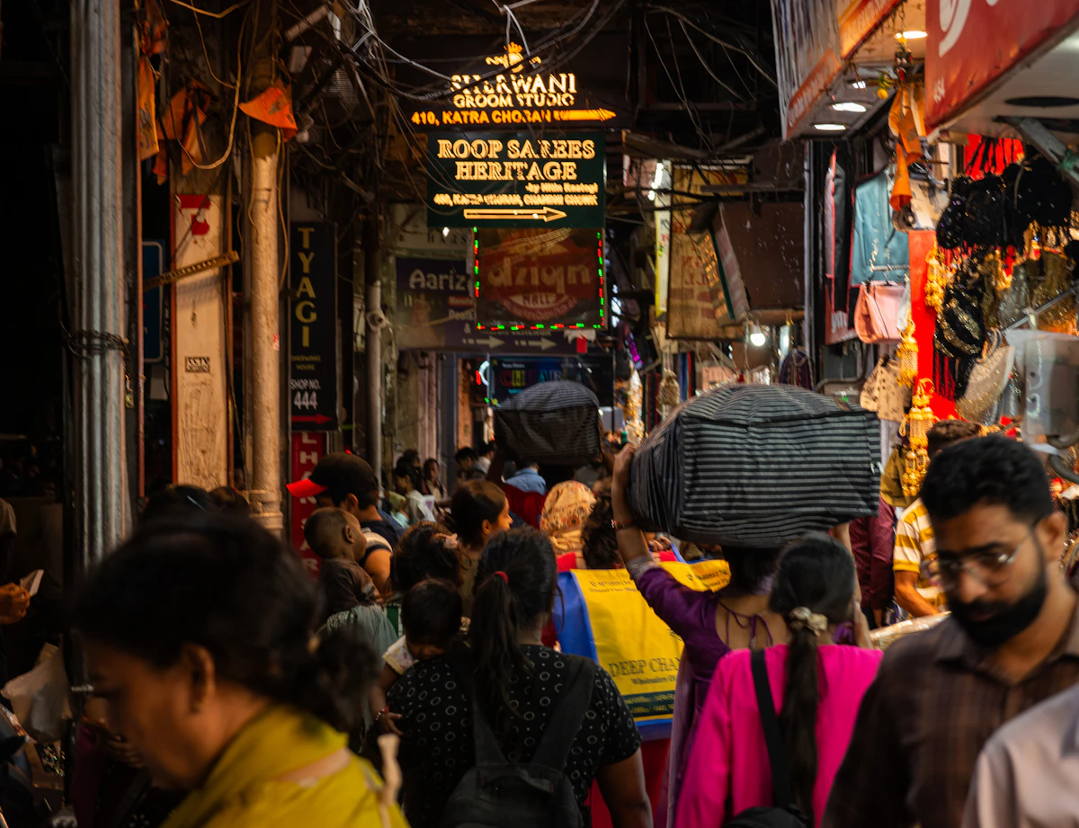 A crowded Indian street market at night