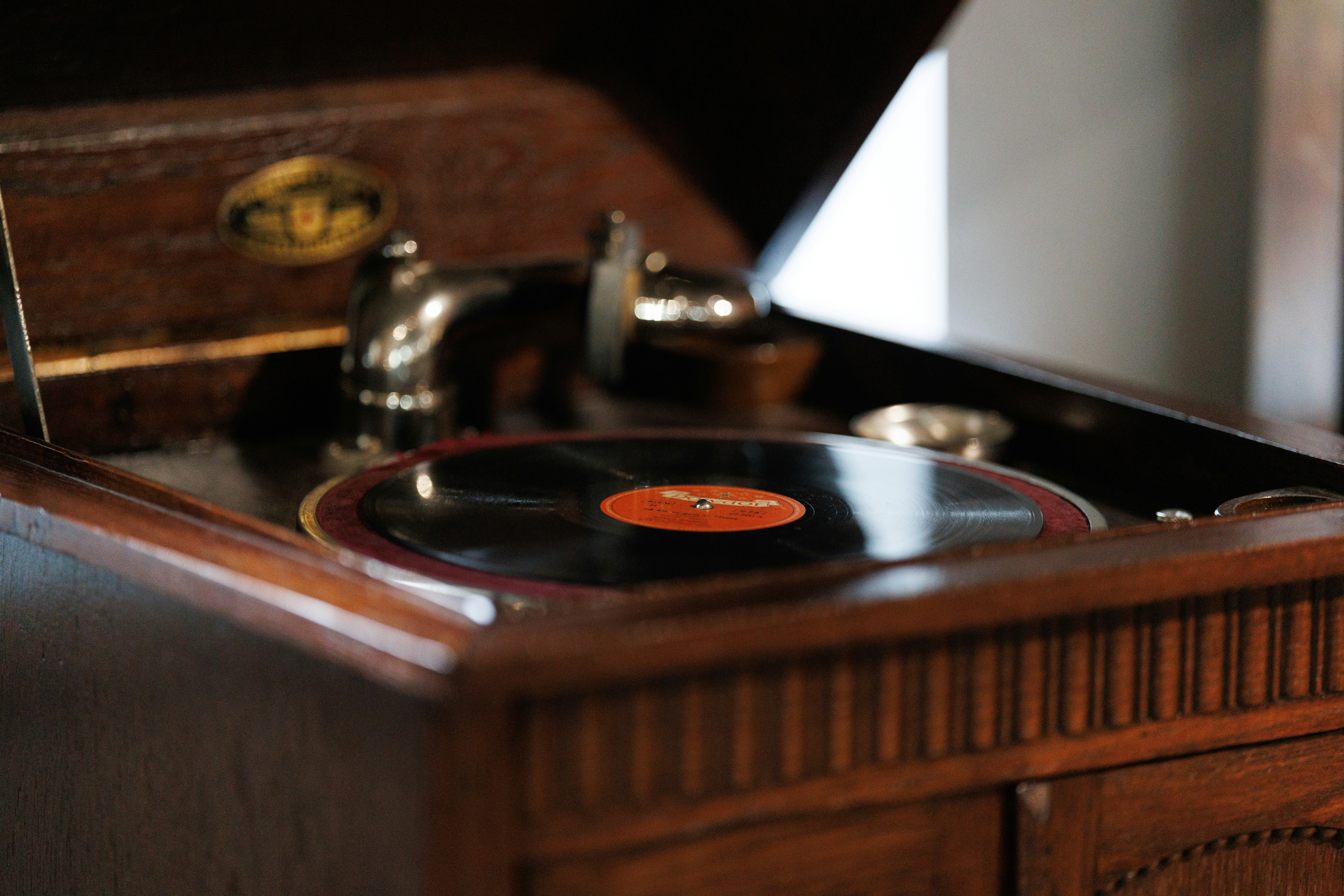 Antique record player with wooden cabinet