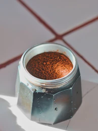 Close-up of moka pot filled with coffee grounds