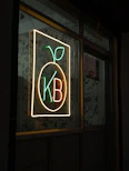 Neon sign with fruit and kb letters kb