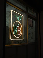 Neon sign with fruit and kb letters kb