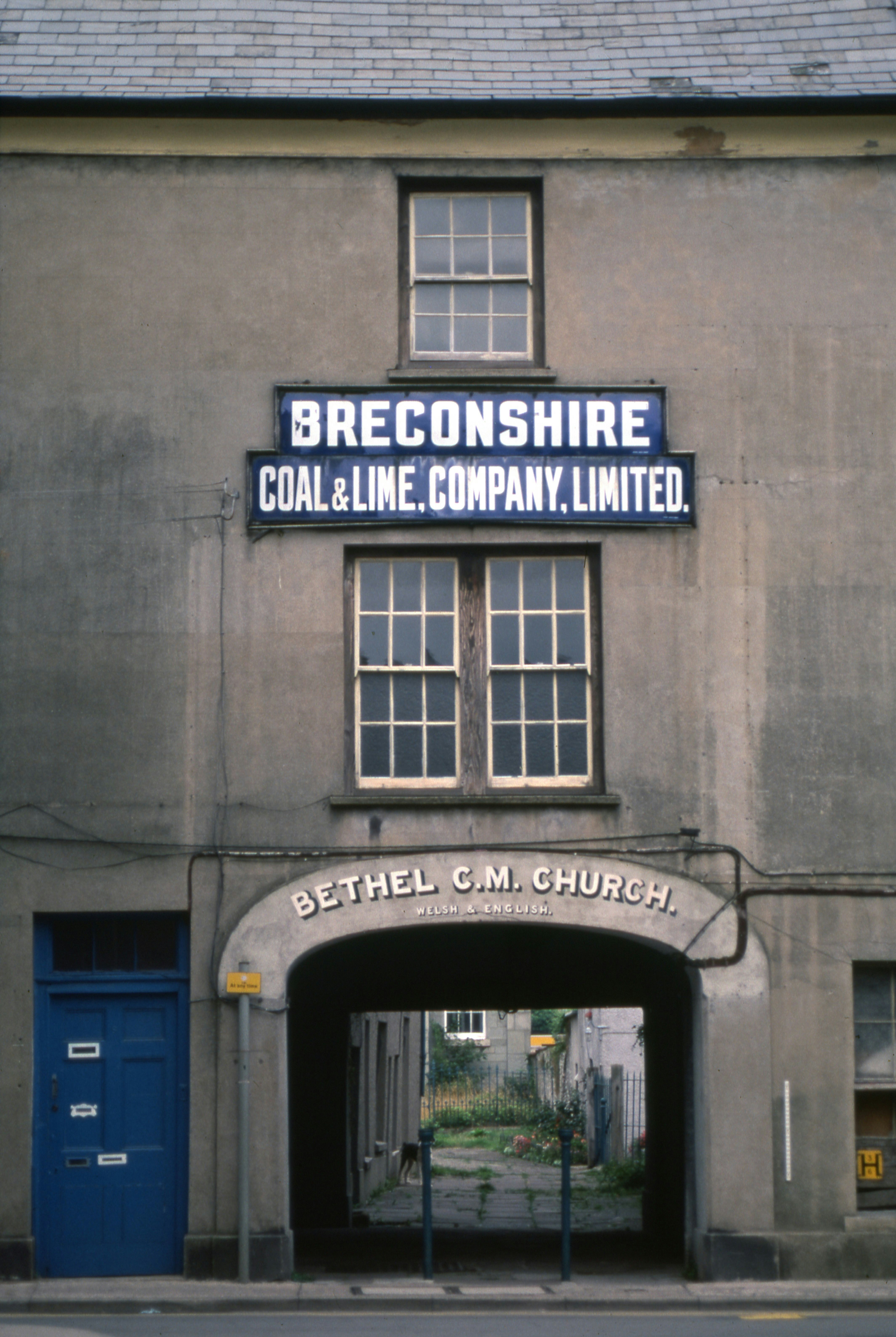 Building with "breconshire coal & lime company" sign.