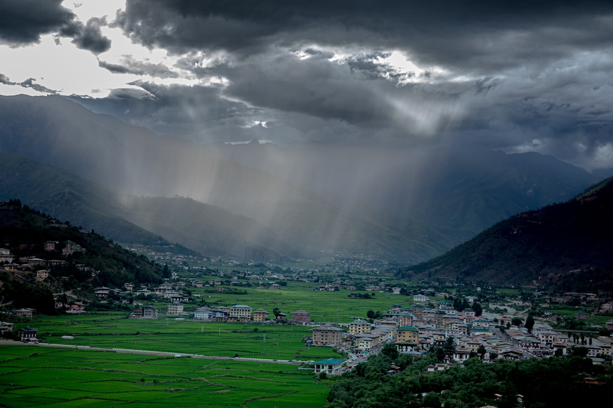 Stormy monsoon clouds rolling over a Himalayan valley town