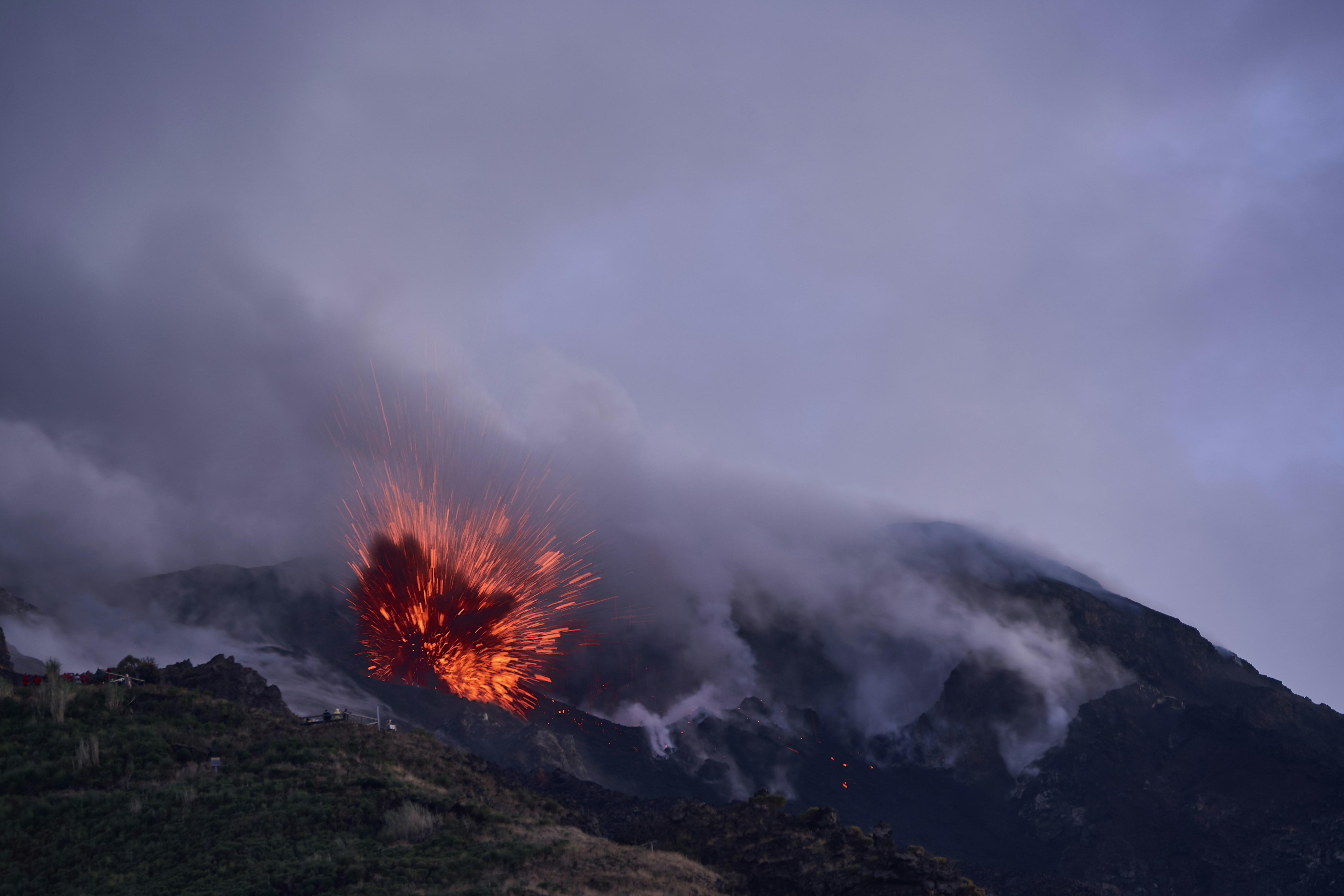 Volcano erupting with glowing lava and smoke