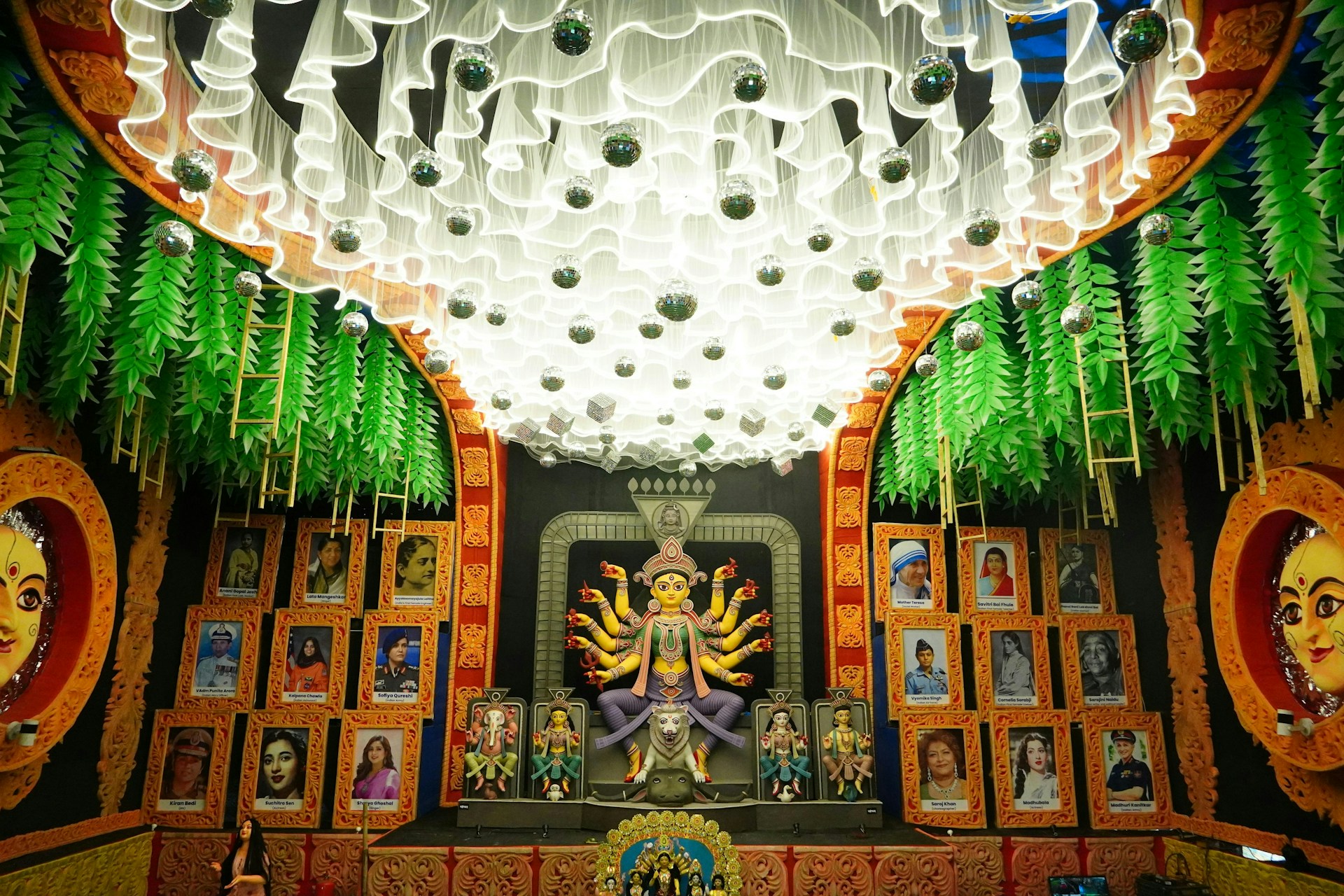 A decorated altar with a statue of a deity.