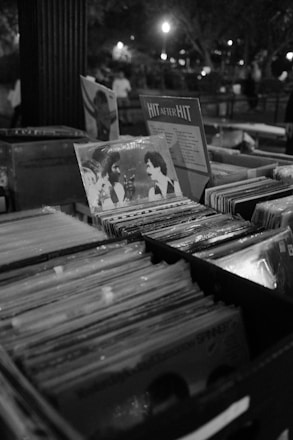 Rows of vinyl records displayed at a market.