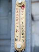 A thermometer shows a cold temperature with a snowman.