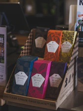 Colorful chocolate bars displayed in a box.