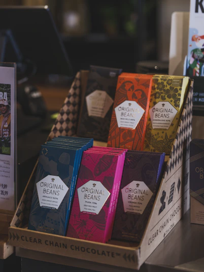 Colorful chocolate bars displayed in a box.