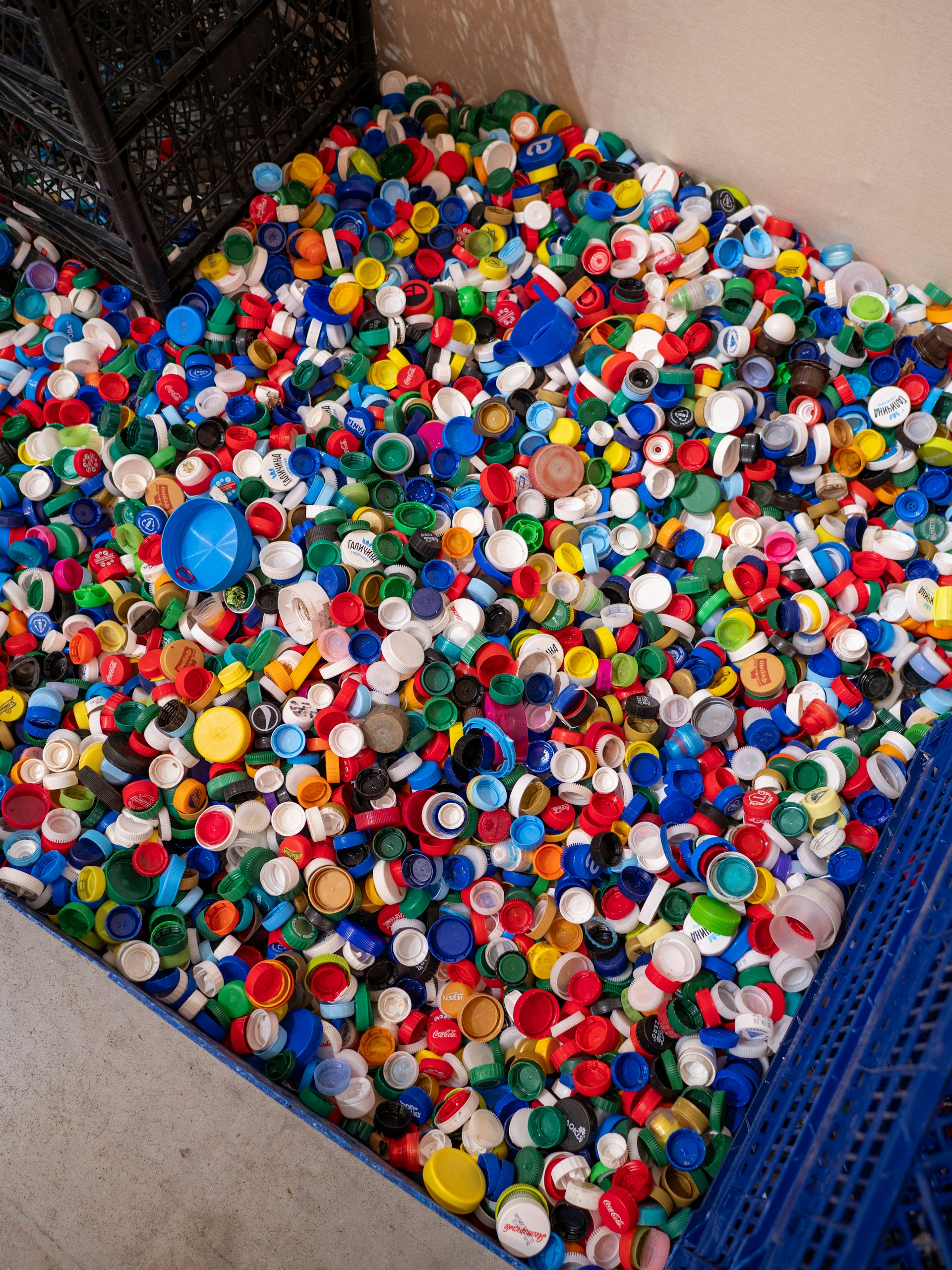 A large pile of colorful plastic bottle caps.