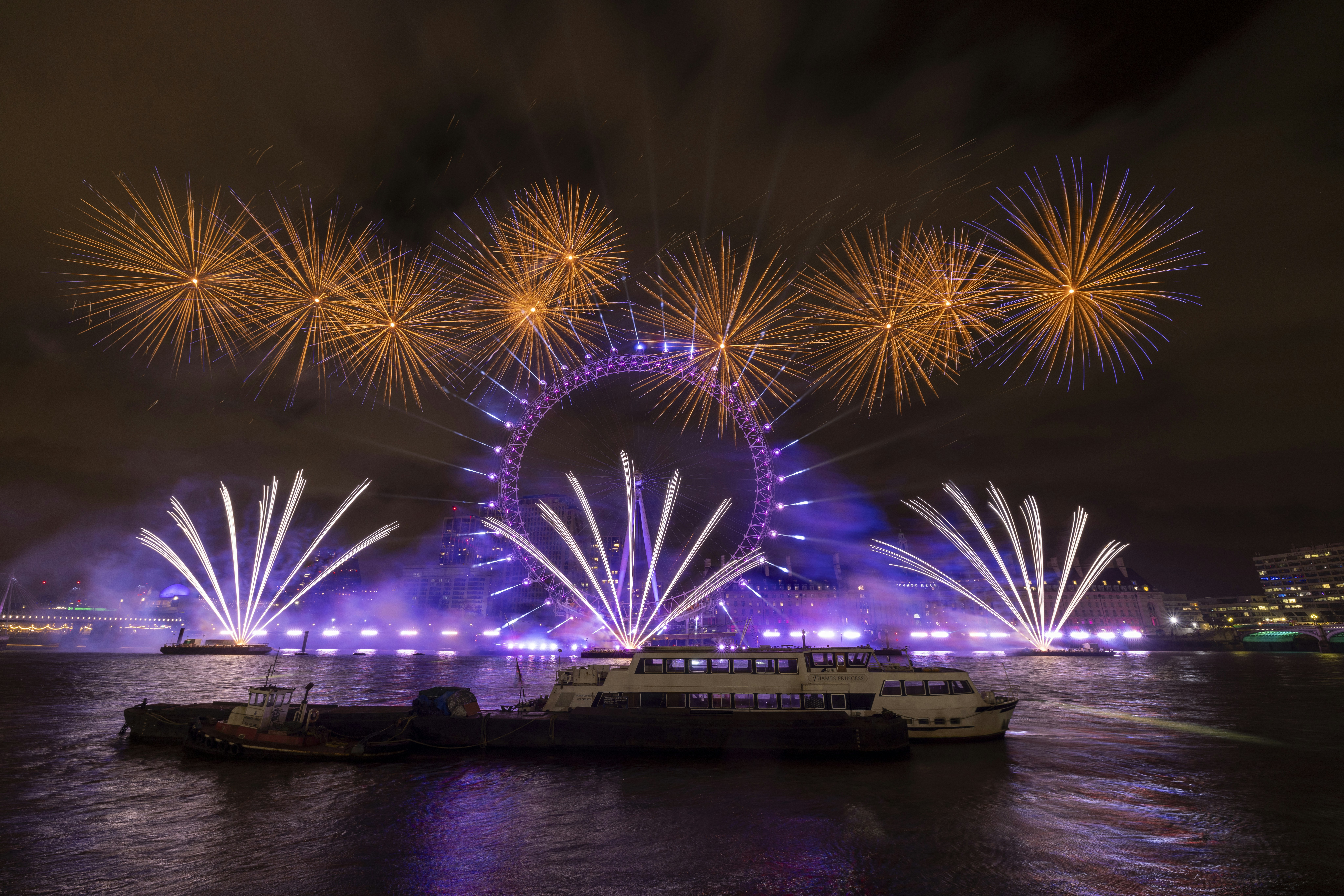 Fireworks over the River Thames and the London Eye at night